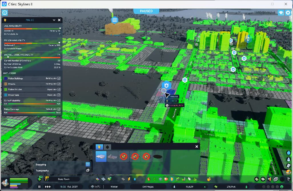 18:21 — The western police addition on the neighborhood street, with the new prison and incinerator visible in the distance. The placement tool remains active. Final checks confirmed one new station, eight staff, and full utilities; patrol travel times were not measured.