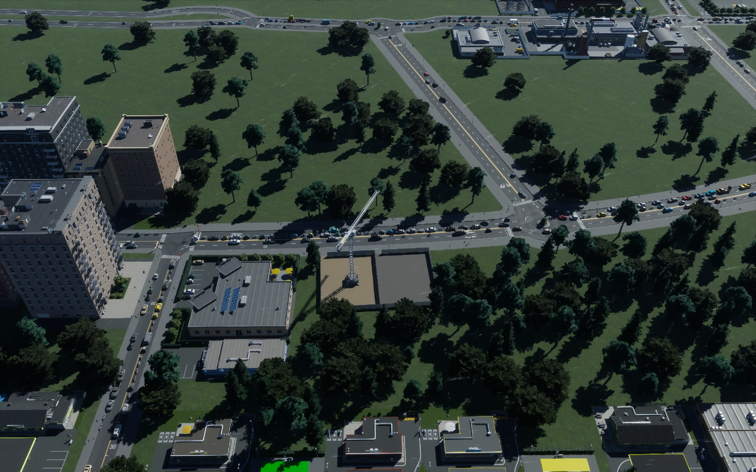 The modest office frontage has a crane and construction site; completed occupied offices are not yet verified.