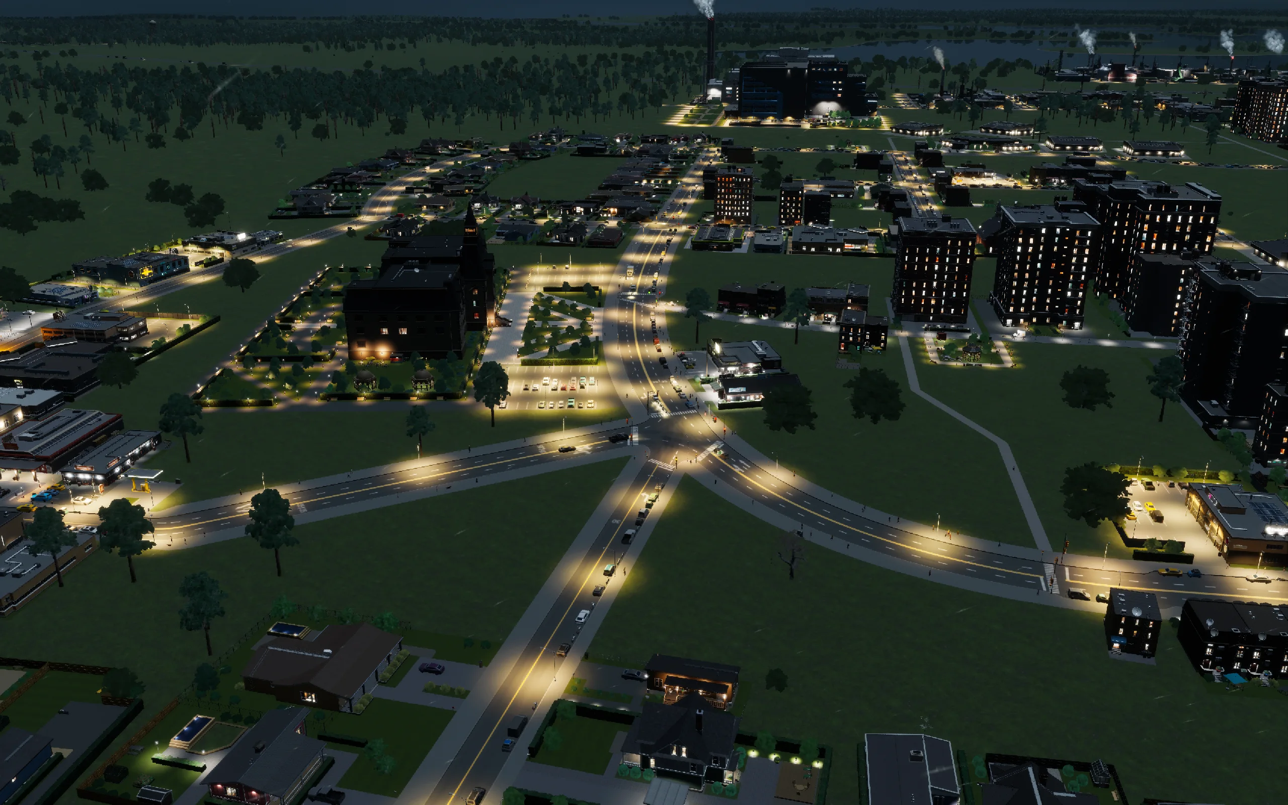 The campus after the wider approach and pedestrian diversion were built. This evening view records the construction result; traffic performance was checked separately.